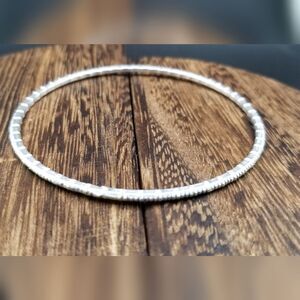 Edgy silver tone rounded bracelet B934